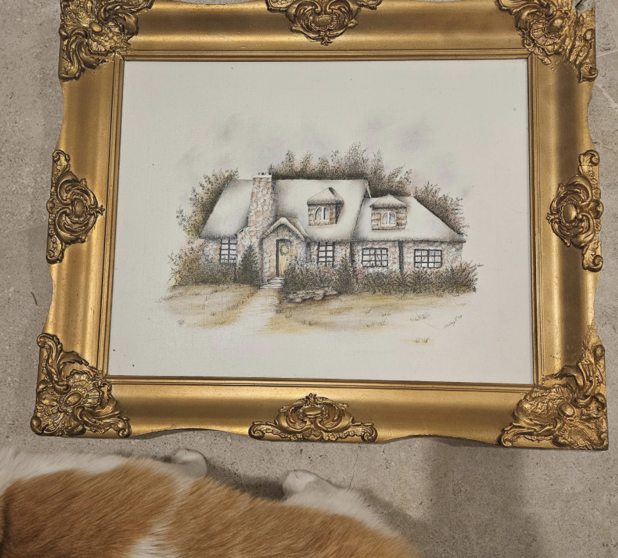 The original reused canvas — a hand-drawn house in nature — inside the gilded frame